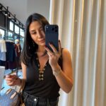 Black Sleeveless Top With Gold Button Detail