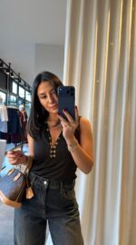 Black Sleeveless Top With Gold Button Detail
